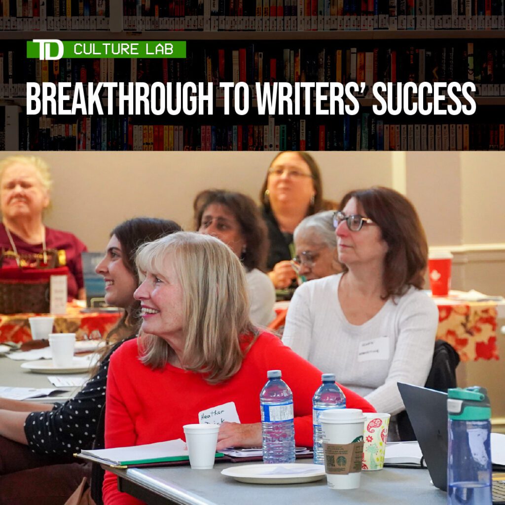 A group of attendees, seated at tables in a workshop setting, smiling and engaging with materials. The event title, "TD Culture Lab - Breakthrough to Writers’ Success," is displayed in white and green text at the top.